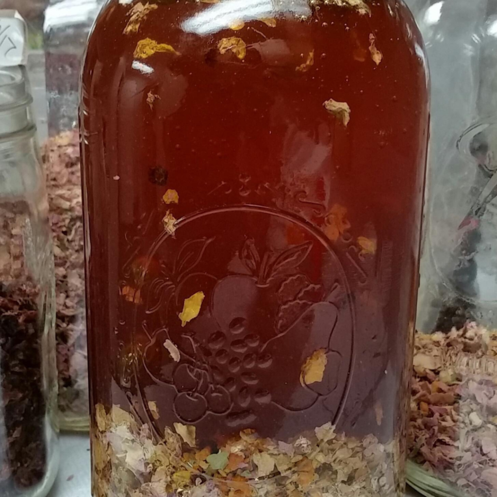 Jar of honey with herbs